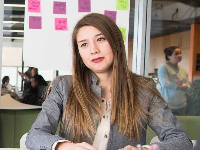 Student dressed business like smiling for a picture