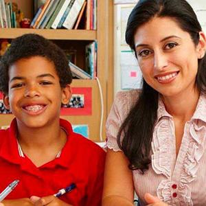 Teacher and student smiling for picture